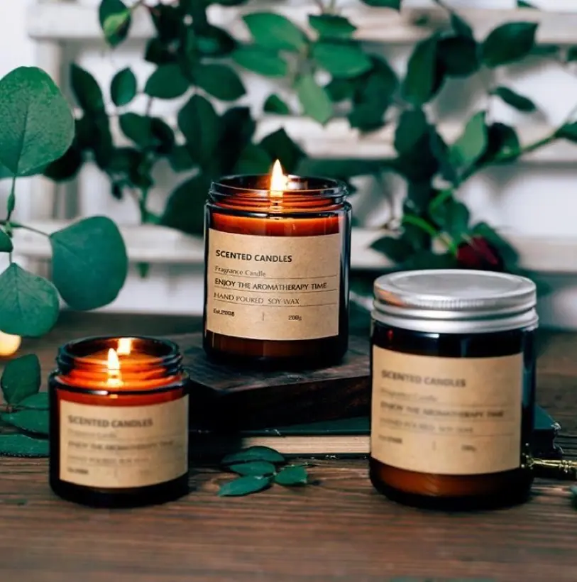 Amber apothecary glass candle jars with kraft labels