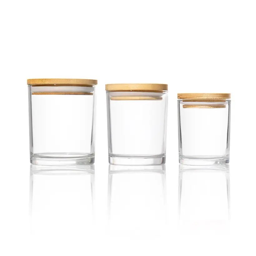 Clear glass candle jars with bamboo lids in three sizes